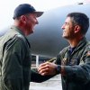 Capt. Hurst and Capt. Cimicata shake hands after landing. The two exchanged change of command while in the air.